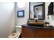 Powder room with vessel sink and wood vanity at 221 Columbus Ave, New Smyrna Beach, FL 32169