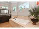 Elegant bathroom featuring a soaking tub and decorative accents at 221 Columbus Ave, New Smyrna Beach, FL 32169