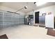 Attached garage with automatic door and storage shelving at 221 Columbus Ave, New Smyrna Beach, FL 32169