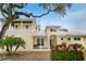 Two-story house with a metal roof and a balcony at 221 Columbus Ave, New Smyrna Beach, FL 32169