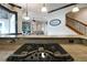 Modern kitchen features a gas cooktop and a view into the adjacent living area at 221 Columbus Ave, New Smyrna Beach, FL 32169