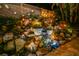 Night view of the backyard waterfall feature at 221 Columbus Ave, New Smyrna Beach, FL 32169