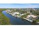 Aerial view of waterfront homes with private docks and pools at 236 Quay Assisi, New Smyrna Beach, FL 32169