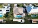 Bird's-eye view of a home, pool, and private dock at 236 Quay Assisi, New Smyrna Beach, FL 32169