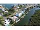 Aerial view of a waterfront home with private pool and dock at 236 Quay Assisi, New Smyrna Beach, FL 32169