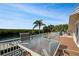 Relaxing balcony with water views and outdoor seating at 236 Quay Assisi, New Smyrna Beach, FL 32169