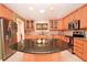 Spacious kitchen with granite countertops and light wood cabinetry at 236 Quay Assisi, New Smyrna Beach, FL 32169