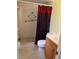 Bathroom with shower, toilet, vanity with sink, and tile floor at 2408 Victory Palm Dr, Edgewater, FL 32141