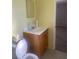 Bathroom featuring a wood vanity, toilet, and mirror at 2408 Victory Palm Dr, Edgewater, FL 32141
