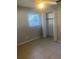 Bedroom with tile floors, closet, and ceiling fan at 2408 Victory Palm Dr, Edgewater, FL 32141