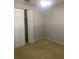 Neutral bedroom featuring carpet, ceiling fan and closet at 2408 Victory Palm Dr, Edgewater, FL 32141