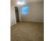 Neutral bedroom featuring carpet, window, ceiling fan and closet at 2408 Victory Palm Dr, Edgewater, FL 32141