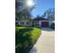House exterior with a red roof, stone accents, and driveway at 2408 Victory Palm Dr, Edgewater, FL 32141