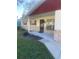 Front view of house with stone facade and covered entryway at 2408 Victory Palm Dr, Edgewater, FL 32141