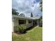 Well-maintained home with stone accents, shutters, and tidy landscaping at 2408 Victory Palm Dr, Edgewater, FL 32141