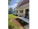 Inviting home exterior with covered porch and landscaped front yard at 2408 Victory Palm Dr, Edgewater, FL 32141