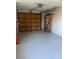 Attached garage with overhead door and shelving at 2408 Victory Palm Dr, Edgewater, FL 32141