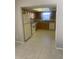 Efficient kitchen with tile floors, wooden cabinets, and modern appliances, offering functionality at 2408 Victory Palm Dr, Edgewater, FL 32141