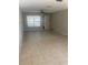 Inviting living space with tiled floors, a ceiling fan, and a bright window for natural light at 2408 Victory Palm Dr, Edgewater, FL 32141