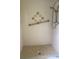 Walk-in shower with tiled walls and grab bar at 2408 Victory Palm Dr, Edgewater, FL 32141