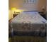 Bedroom with a queen-sized bed and a patchwork quilt at 2421 Silver Palm Dr, Edgewater, FL 32141