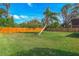 Large backyard with new wood fence and palm tree at 2507 Milton Ave, New Smyrna Beach, FL 32168