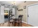 Bright dining area with glass table and sliding doors leading to patio at 2507 Milton Ave, New Smyrna Beach, FL 32168