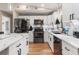 Modern kitchen with white cabinets and a large island at 2507 Milton Ave, New Smyrna Beach, FL 32168