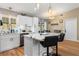 Modern kitchen featuring white cabinets, quartz countertops, and an island at 2507 Milton Ave, New Smyrna Beach, FL 32168