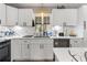 White kitchen cabinets and quartz countertops at 2507 Milton Ave, New Smyrna Beach, FL 32168