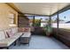 Relaxing screened porch with seating and potted plants at 2507 Milton Ave, New Smyrna Beach, FL 32168