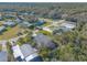 Aerial view of a residential community showing homes and lush landscaping at 258 Navajo Dr, Oak Hill, FL 32759