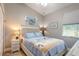 Bedroom with a full-size bed and coastal decor at 258 Navajo Dr, Oak Hill, FL 32759