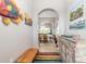 Inviting entryway with decorative console table and colorful rug at 258 Navajo Dr, Oak Hill, FL 32759