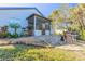 Screened porch and stone patio create a relaxing outdoor space at 258 Navajo Dr, Oak Hill, FL 32759