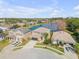 Aerial view of homes near a lake, showcasing neighborhood setting at 2707 Atlantis Dr, New Smyrna Beach, FL 32168