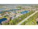 Wide aerial view of a large residential area with lakes and roads at 2707 Atlantis Dr, New Smyrna Beach, FL 32168