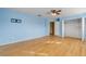 Light blue bedroom with wood floors and spacious closet at 2707 Atlantis Dr, New Smyrna Beach, FL 32168