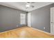 Gray-walled bedroom with hardwood floors and ceiling fan at 2707 Atlantis Dr, New Smyrna Beach, FL 32168