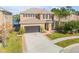 Two-story house with a large driveway and landscaped yard at 2707 Atlantis Dr, New Smyrna Beach, FL 32168