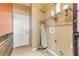 Laundry room with shelving and a door to exterior at 2707 Atlantis Dr, New Smyrna Beach, FL 32168