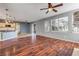 Living room with kitchen island view and hardwood floors at 2707 Atlantis Dr, New Smyrna Beach, FL 32168