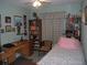 Cozy bedroom with built-in shelving and a desk at 2715 Banyan Dr, Edgewater, FL 32141