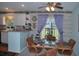 Cozy dining area with wood table and chairs, adjacent to a kitchen at 2715 Banyan Dr, Edgewater, FL 32141