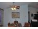 Bright dining area with wood table and chairs near a window at 2715 Banyan Dr, Edgewater, FL 32141