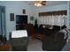 Bright living room with ample seating and entertainment center at 2715 Banyan Dr, Edgewater, FL 32141