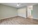 Bright bedroom with wood-look floors and built-in closet at 28 Lake Fairgreen Cir, New Smyrna Beach, FL 32168