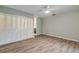 Well-lit bedroom with wood-look floors and ample closet space at 28 Lake Fairgreen Cir, New Smyrna Beach, FL 32168