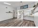 Open dining area with gray vinyl flooring and pendant lighting at 28 Lake Fairgreen Cir, New Smyrna Beach, FL 32168