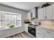 Kitchen with stainless steel appliances and bay window at 28 Lake Fairgreen Cir, New Smyrna Beach, FL 32168